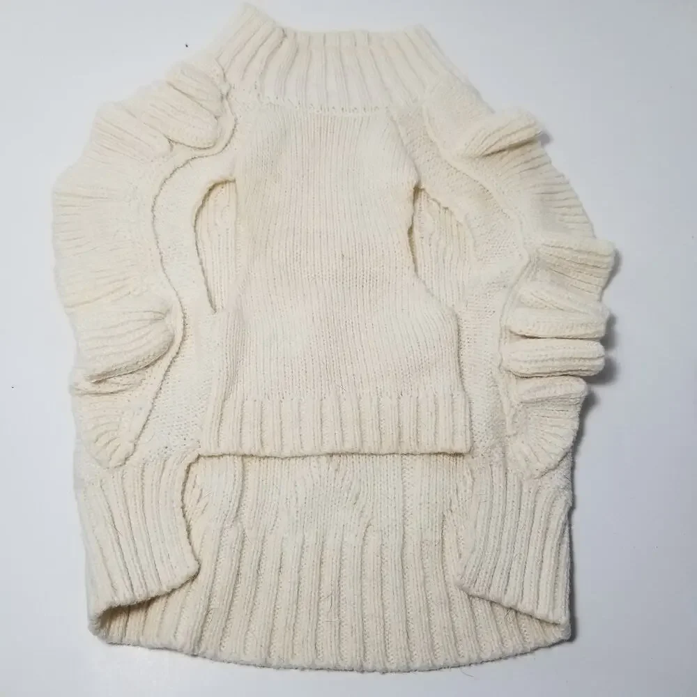 small girl doggie light sweater  one small faint stain on underside of sweater
